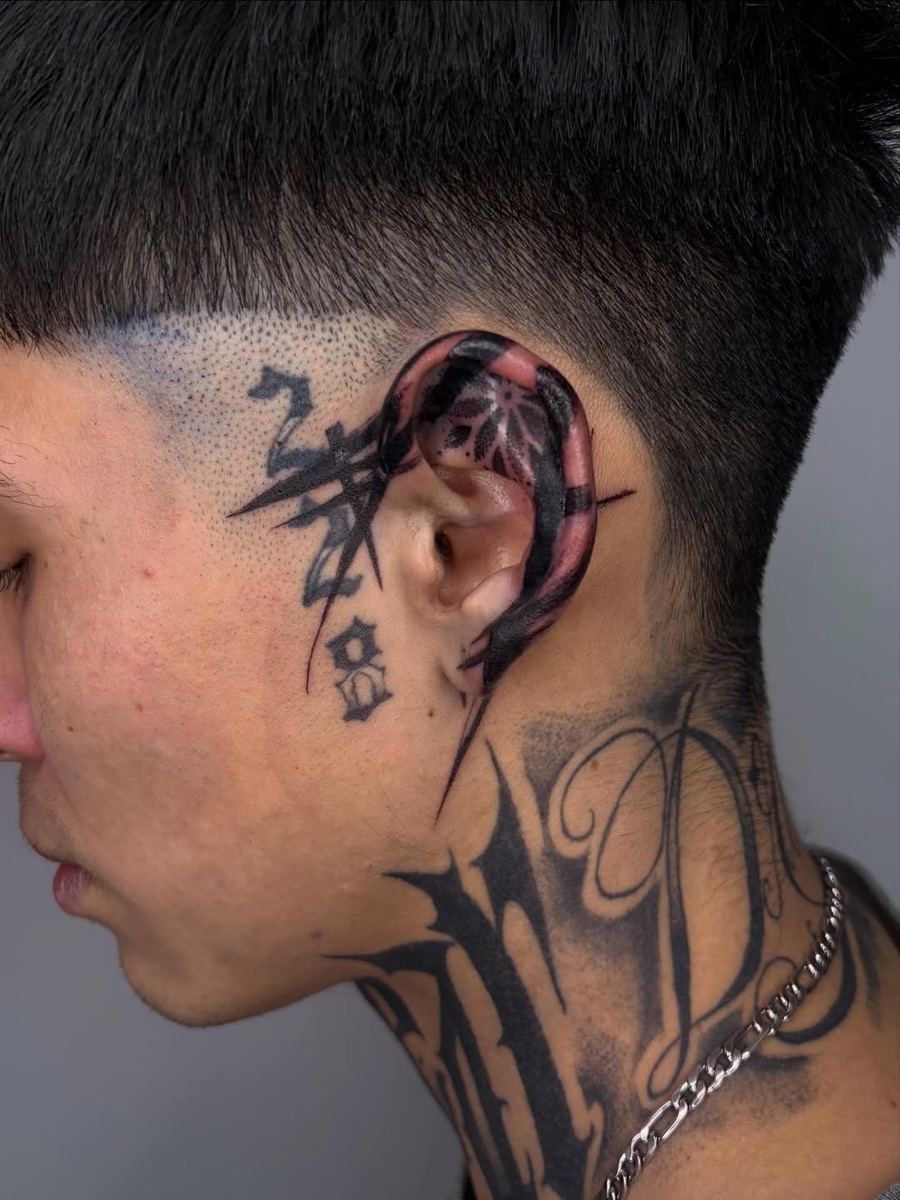 Black and grey neck tattoo at Yes Electric Tattoo