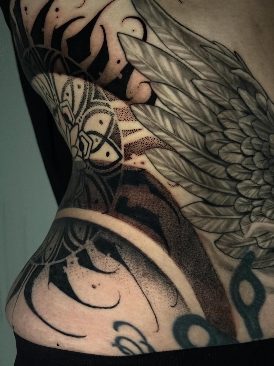 Mandala and floral black and grey leg tattoo at Yes Electric