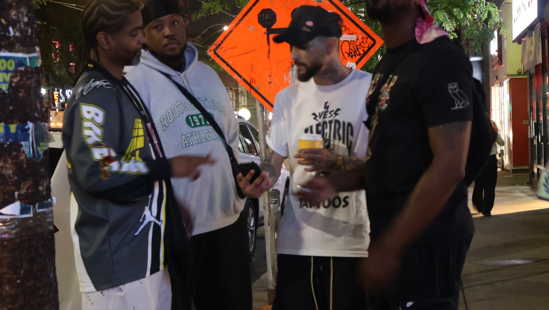 The Yes Electric Tattoo crew outside the Queen West Toronto studio at night